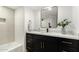 Clean bathroom with updated vanity and bathtub at 6056 E Harvard St, Scottsdale, AZ 85257