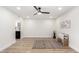 Bright bedroom with wood-look floors and ceiling fan at 6056 E Harvard St, Scottsdale, AZ 85257