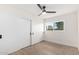 Bedroom with white closet doors and wood-look flooring at 6056 E Harvard St, Scottsdale, AZ 85257
