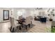 Open dining area with seating for four and wood floors at 6056 E Harvard St, Scottsdale, AZ 85257
