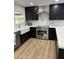 Modern kitchen with stainless steel appliances and white quartz countertops at 6056 E Harvard St, Scottsdale, AZ 85257