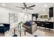 Open living room with contemporary kitchen and island at 6056 E Harvard St, Scottsdale, AZ 85257