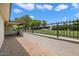 Brick paved patio with a wall and wrought iron fence at 6056 E Harvard St, Scottsdale, AZ 85257