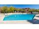 Community pool with steps and surrounding fence at 6056 E Harvard St, Scottsdale, AZ 85257