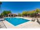 Community pool with lounge chairs and a pool house at 6056 E Harvard St, Scottsdale, AZ 85257