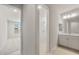 Well-lit bathroom with double vanity, white cabinets, and a walk-in shower at 7674 W Cactus Wren Way, Florence, AZ 85132