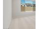 A light-filled room featuring carpeted floors and a large window with backyard views at 7674 W Cactus Wren Way, Florence, AZ 85132