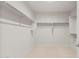 Walk-in closet features carpeted floor, shelving, and closet rods for optimal storage at 7674 W Cactus Wren Way, Florence, AZ 85132
