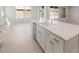 Bright kitchen island with sleek sink and stainless steel dishwasher at 7674 W Cactus Wren Way, Florence, AZ 85132