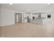 Open-concept kitchen boasts stainless steel appliances, white cabinets, and a spacious island at 7674 W Cactus Wren Way, Florence, AZ 85132