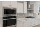 Well-equipped kitchen features built in microwave and oven plus a modern gas cooktop at 7674 W Cactus Wren Way, Florence, AZ 85132