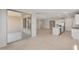 Bright living room features sliding glass doors and tile flooring, seamlessly connecting indoor and outdoor spaces at 7674 W Cactus Wren Way, Florence, AZ 85132