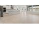 Large, open floorplan includes a kitchen and large format tile flooring at 7674 W Cactus Wren Way, Florence, AZ 85132