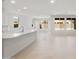 Bright, open-concept floor plan with kitchen island and large windows at 7674 W Cactus Wren Way, Florence, AZ 85132