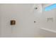 The stand-up shower has a seat, textured wall tiles, and bronze fixtures at 7674 W Cactus Wren Way, Florence, AZ 85132