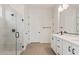Elegant bathroom featuring a glass shower, double vanity, and neutral flooring, blending style with functionality at 7682 W Mockingbird Way, Florence, AZ 85132