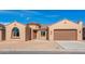 Charming single-story stucco home featuring a tile roof, attached garage, and desert landscaping at 7682 W Mockingbird Way, Florence, AZ 85132