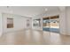 Spacious living room featuring hardwood floors and large sliding doors with access to the backyard at 7682 W Mockingbird Way, Florence, AZ 85132