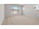 Bedroom featuring carpeted floors and large windows that let in plenty of natural light at 7736 W Mockingbird Way, Florence, AZ 85132