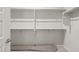 Walk-in closet featuring shelving and hanging space for ample storage at 7736 W Mockingbird Way, Florence, AZ 85132
