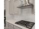 Close-up of a modern kitchen with stainless steel appliances, gray cabinets, and sleek countertops at 7736 W Mockingbird Way, Florence, AZ 85132