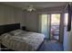 Bedroom with private access to balcony and a ceiling fan at 1720 E Thunderbird Rd # 2015, Phoenix, AZ 85022