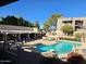 Community pool with lounge chairs and covered area at 1720 E Thunderbird Rd # 2015, Phoenix, AZ 85022