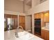Kitchen with double sink, stainless steel appliances, and wood cabinets at 23307 N 71St Dr, Glendale, AZ 85310