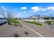 Attractive, well-maintained community landscaping with gravel beds, desert plants, and lush green turf at 2334 E Levi Dr, Phoenix, AZ 85040