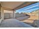 Covered patio overlooks a spacious backyard at 26722 N 174Th Ln, Surprise, AZ 85387