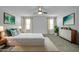 Bright bedroom featuring a plush bed, neutral decor, and ample natural light at 26722 N 174Th Ln, Surprise, AZ 85387