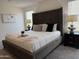 Cozy bedroom showcasing a large bed with modern linens, inviting comfort and style at 26722 N 174Th Ln, Surprise, AZ 85387