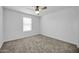 Cozy bedroom with window and ceiling fan at 26722 N 174Th Ln, Surprise, AZ 85387