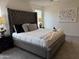 Bright bedroom featuring a plush bed, soft carpet, and neutral decor for a relaxing ambiance at 26722 N 174Th Ln, Surprise, AZ 85387