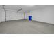 Bright and clean garage interior with overhead door at 26722 N 174Th Ln, Surprise, AZ 85387