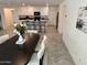 Open-concept kitchen with modern appliances, an island with barstools, and ample cabinet space at 26722 N 174Th Ln, Surprise, AZ 85387