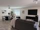 Inviting living room with a modern dining area, comfortable seating, and a neutral color palette at 26722 N 174Th Ln, Surprise, AZ 85387