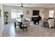 Open-concept living and dining area with modern decor, including a dining table and comfortable seating at 26722 N 174Th Ln, Surprise, AZ 85387