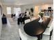 Spacious living area with modern furniture, a dining table, and an open layout to the kitchen at 26722 N 174Th Ln, Surprise, AZ 85387