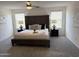 Serene main bedroom with a tufted headboard, soft lighting, and a cozy ambiance at 26722 N 174Th Ln, Surprise, AZ 85387