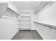 Large walk-in closet with hanging rods and shelves at 26722 N 174Th Ln, Surprise, AZ 85387