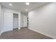 Bright bedroom with hardwood floors, ceiling fan, and spacious closet at 3436 E Fairmount Ave, Phoenix, AZ 85018