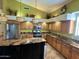 Island kitchen with granite countertops and stainless steel appliances at 5431 E Shea Blvd, Scottsdale, AZ 85254