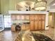 Kitchen boasts granite counters, custom cabinetry, and a built-in desk at 5431 E Shea Blvd, Scottsdale, AZ 85254
