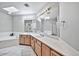 Spa-like bathroom with dual vanities and a large shower at 6002 N 5Th Pl, Phoenix, AZ 85012