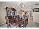 Elegant dining room with a large wood table and matching chairs at 6002 N 5Th Pl, Phoenix, AZ 85012