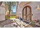 Elegant arched front door entryway with landscaping at 6002 N 5Th Pl, Phoenix, AZ 85012