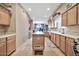 Open kitchen with island and view into dining area at 6002 N 5Th Pl, Phoenix, AZ 85012
