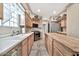 Modern kitchen with stainless steel appliances and light wood cabinets at 6002 N 5Th Pl, Phoenix, AZ 85012