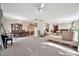 Open living room and dining area with a high ceiling and neutral color palette at 6002 N 5Th Pl, Phoenix, AZ 85012